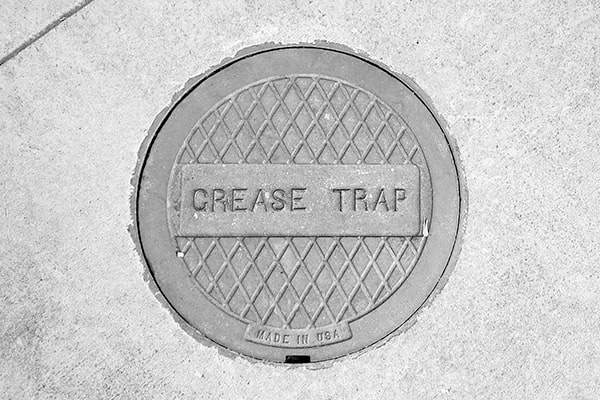 grease trap pumping involves removing built-up grease and other waste from the trap to prevent clogs and overflows